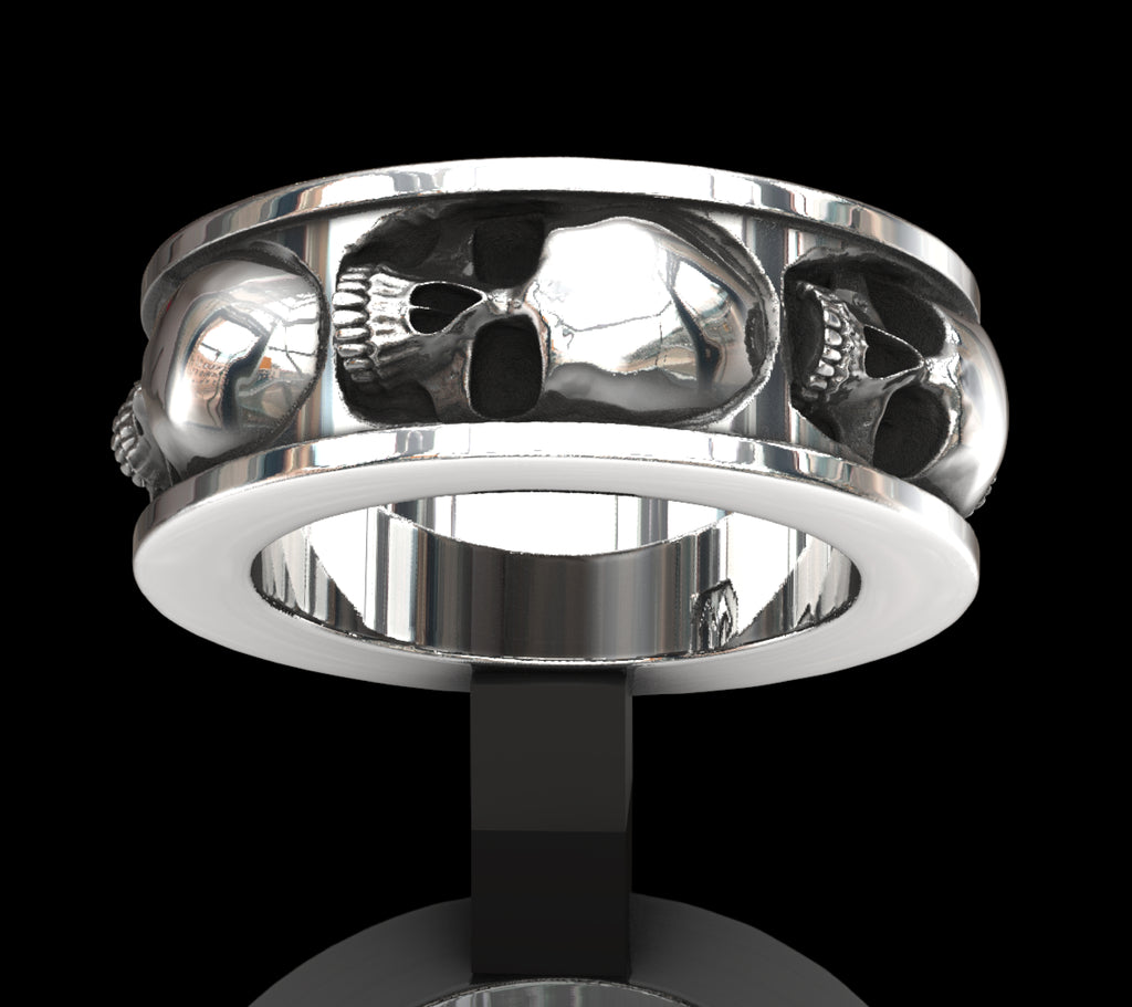 Five skull band ring