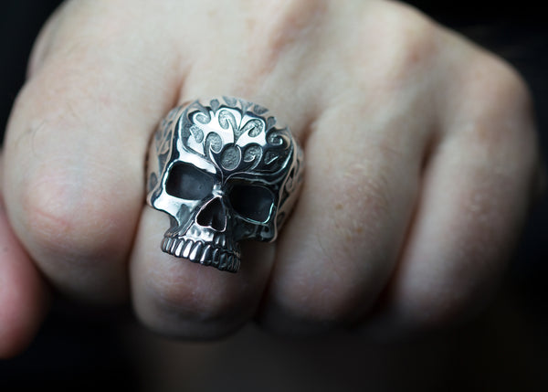 Carved sterling silver skull rings.