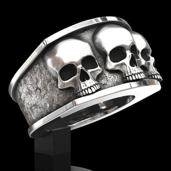 Three skull ring