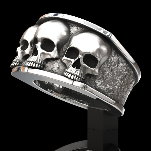 Three skull ring