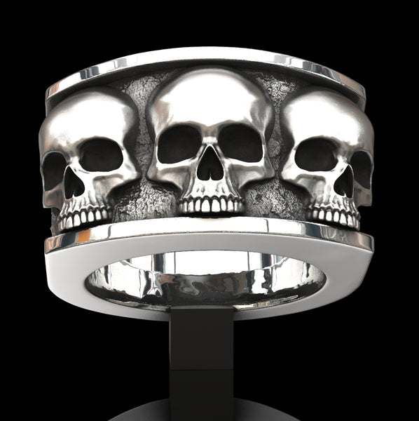 Three skull ring