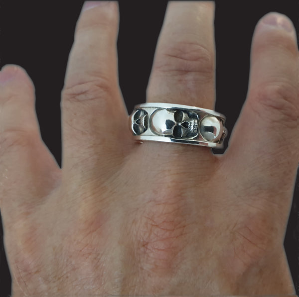 Five skull band ring