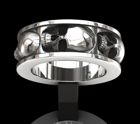 Five skull band ring