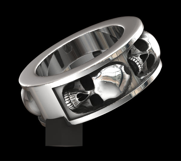 Five skull band ring